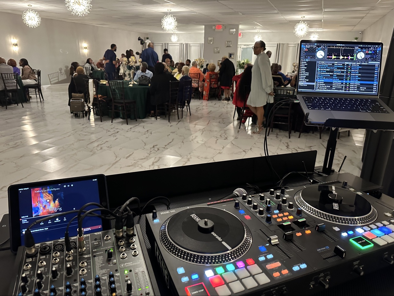 Banquet hall celebration seen from the DJ booth